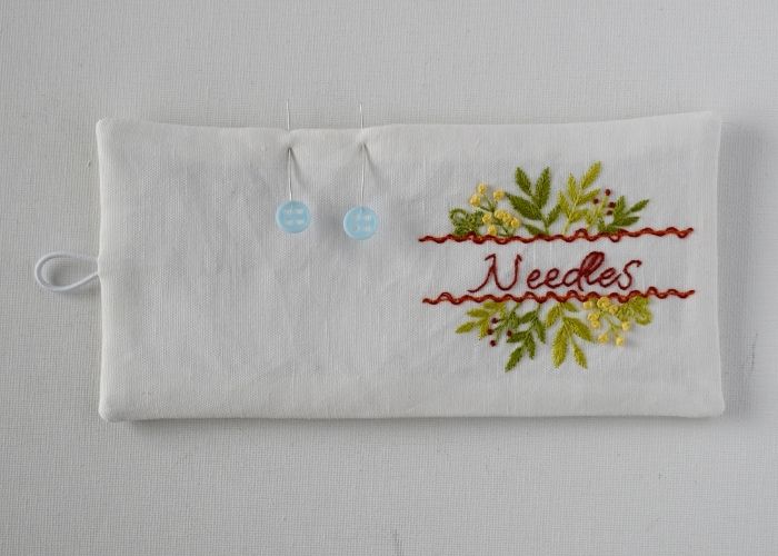 Iron embroidered needle case